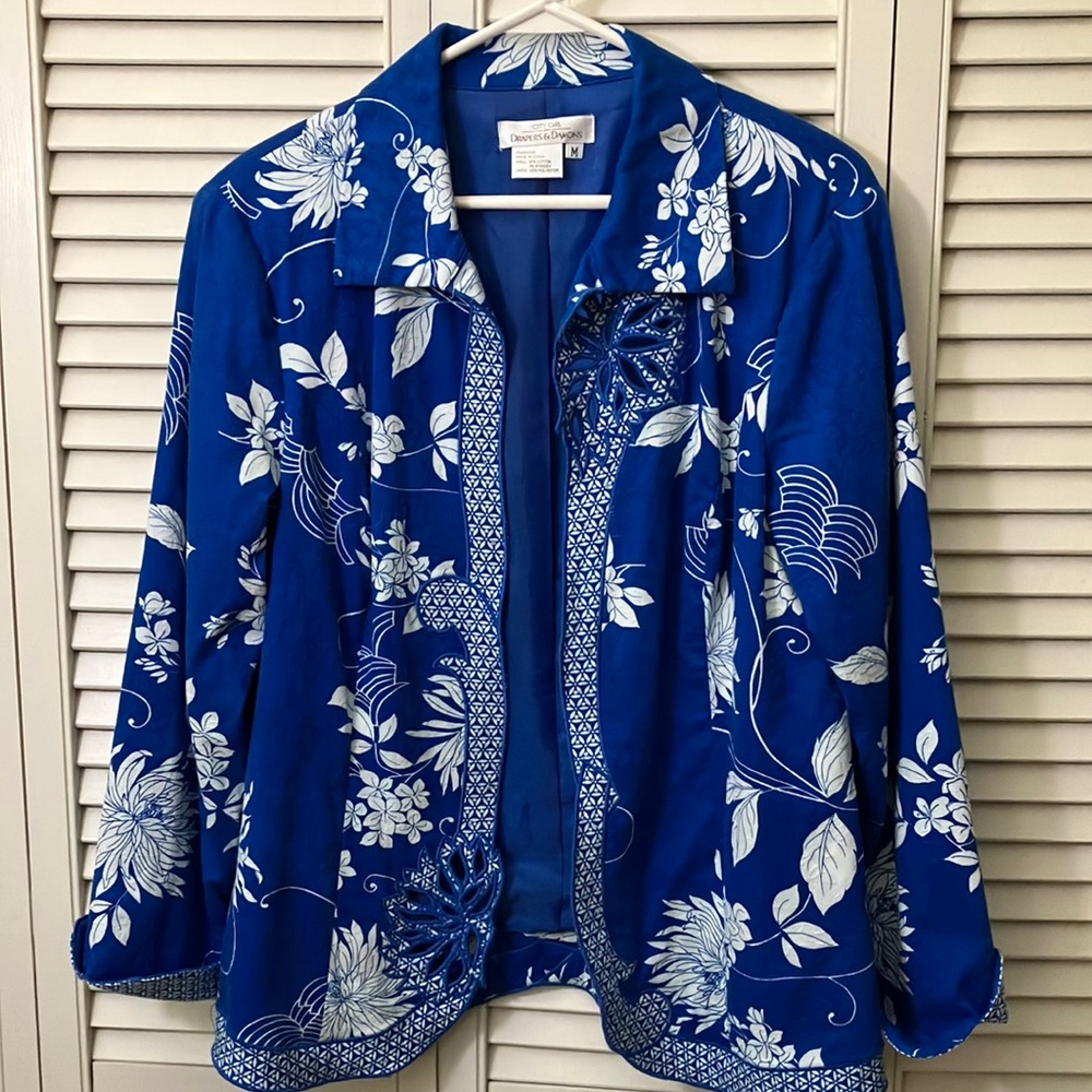 Beautiful jacket with cutout designs and beading along front edge